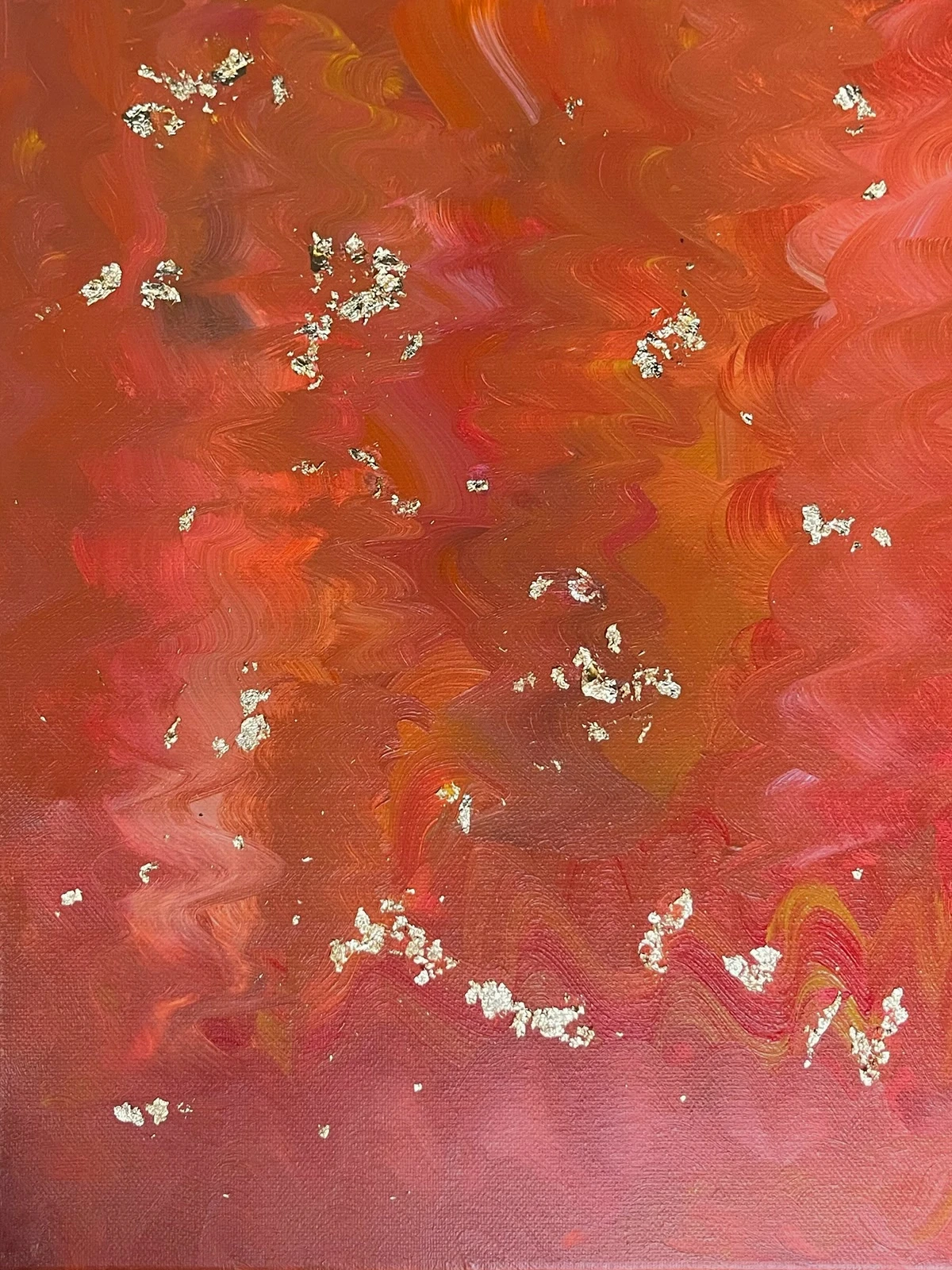 Coral and burnt-orange abstract painting with sweeping brushwork and scattered gold-toned flecks
